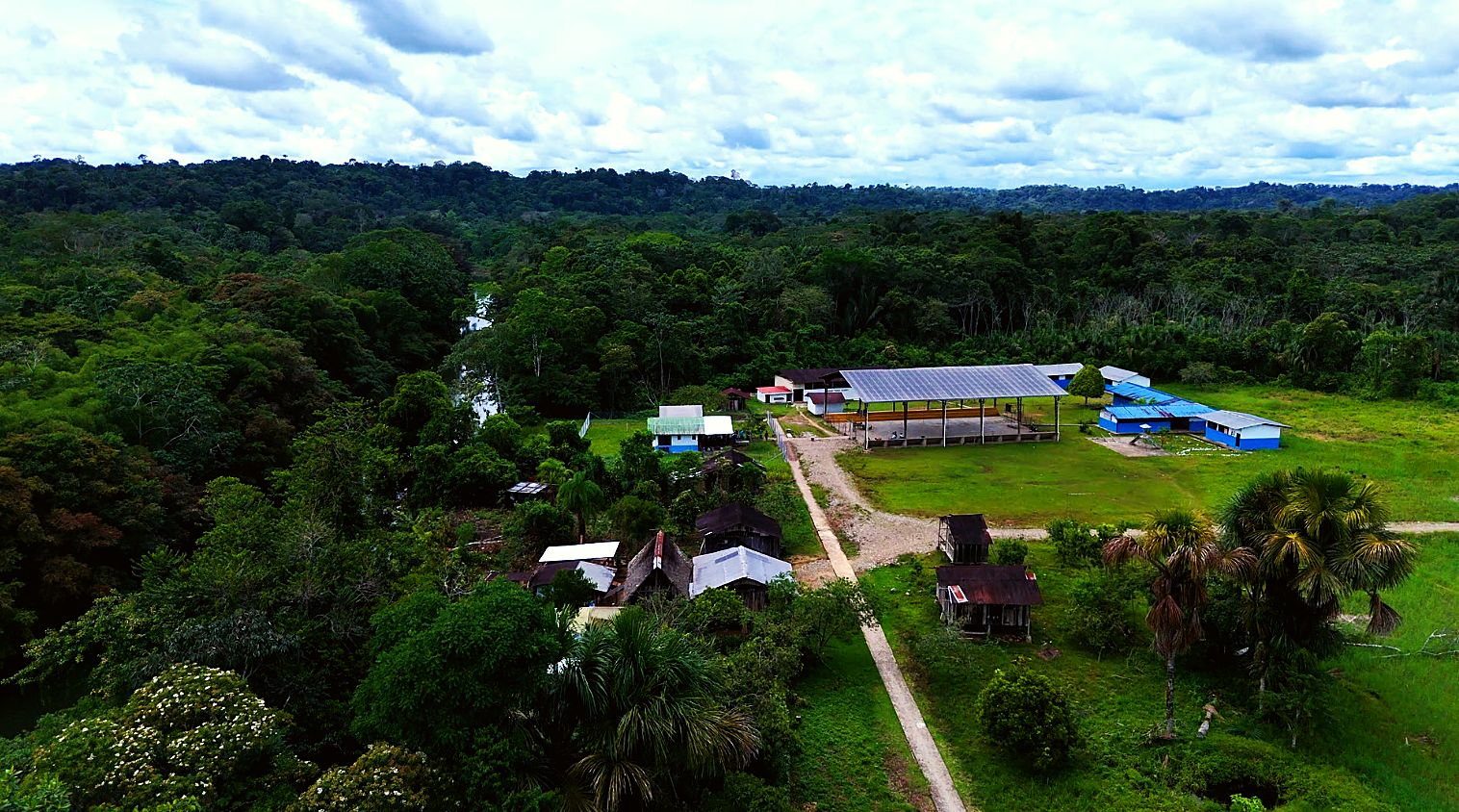 Aerial view of Verde Sumaco with the covered stadium we built and other buildings