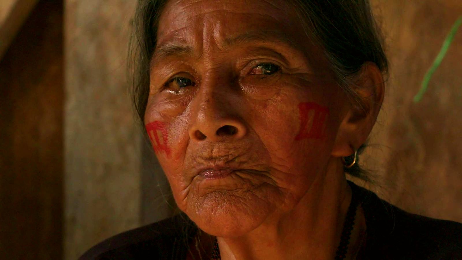 An elder of Verde Sumaco with traditional face paint