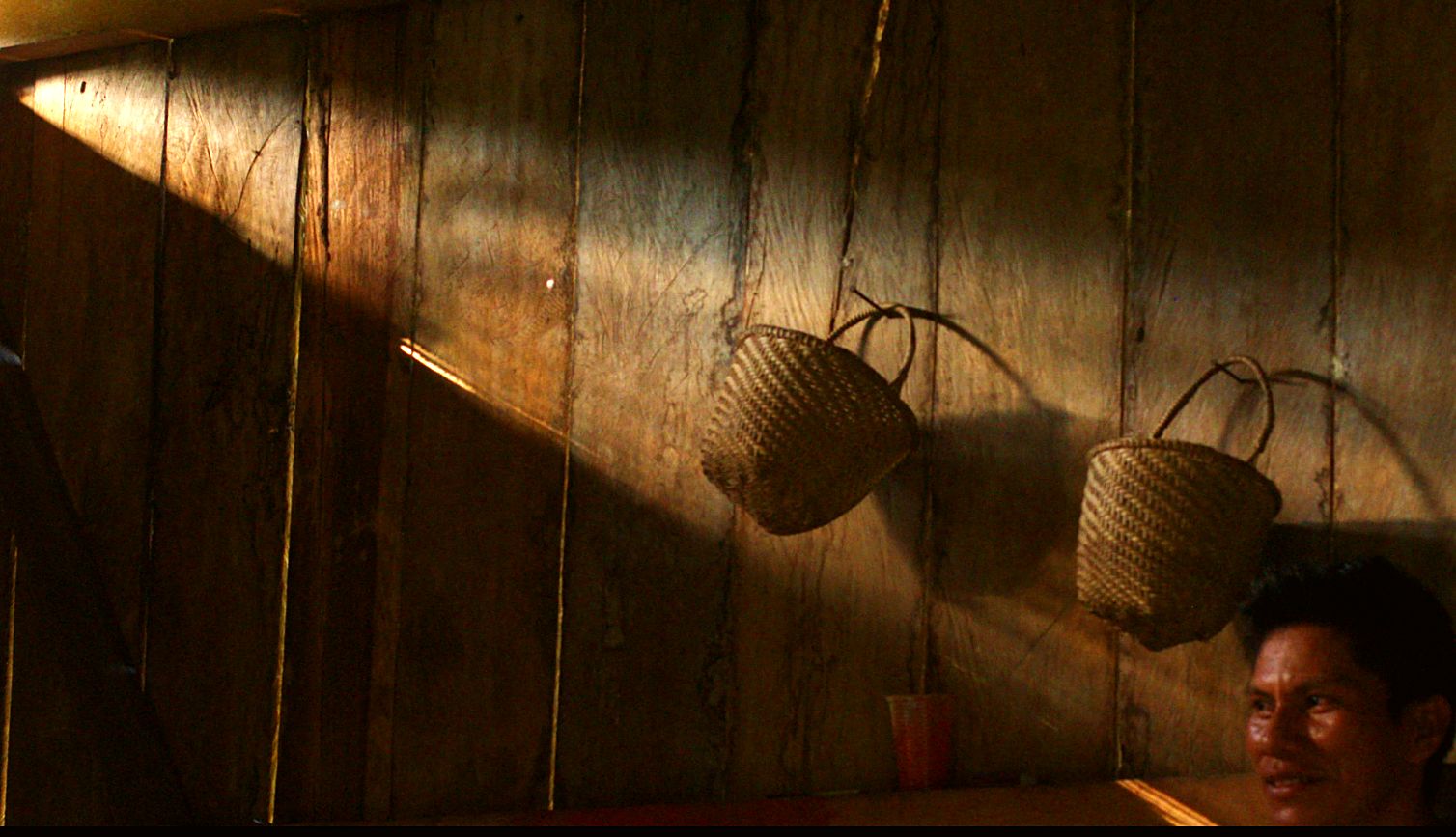 Woven baskets hanging in afternoon light
